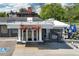 Restaurant exterior with white awning, large Syrup sign, and accessible parking space nearby at 1652 N Lafayette St # 6, Denver, CO 80218