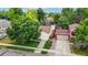 Aerial view of property showing the backyard, storage shed, and mature trees at 1750 Clark Dr, Erie, CO 80516
