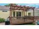 Outdoor deck with pergola, dining set and grill for outdoor dining and entertaining at 1750 Clark Dr, Erie, CO 80516