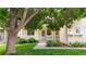 Charming home with a well-manicured lawn, front porch, and mature trees at 1750 Clark Dr, Erie, CO 80516