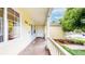 Cozy porch with natural wood floor and white railing, adorned with plants at 1750 Clark Dr, Erie, CO 80516
