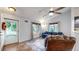 Bright living area featuring hardwood floors, sofa and large windows at 1750 Clark Dr, Erie, CO 80516
