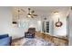 Cozy living room with hardwood floors flowing to kitchen area at 1750 Clark Dr, Erie, CO 80516