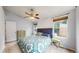 Spacious bedroom with comfortable bedding and natural light from large windows at 1750 Clark Dr, Erie, CO 80516