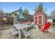 This backyard is an outdoor living space with seating, string lights, and a shed at 1025 Zang St, Golden, CO 80401