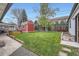 Spacious backyard featuring a well-maintained lawn, shed, and space for outdoor activities at 1025 Zang St, Golden, CO 80401