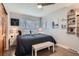 A bedroom features dark wood floors, modern décor, and a ceiling fan at 1025 Zang St, Golden, CO 80401