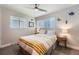 Bedroom featuring light gray walls, hardwood floors, and natural light at 1025 Zang St, Golden, CO 80401