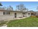 Well-maintained exterior with a lush lawn and easy access to the backyard at 1025 Zang St, Golden, CO 80401