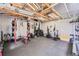 A workout area has exposed beams, a rubber floor, and a weight rack at 1025 Zang St, Golden, CO 80401