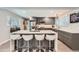 Contemporary kitchen with stainless steel appliances, sleek cabinets, and a central island with bar stools at 1025 Zang St, Golden, CO 80401