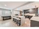 Bright kitchen featuring a large island with seating, stainless steel appliances, and modern finishes at 1025 Zang St, Golden, CO 80401
