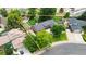 Sprawling ranch-style home with manicured landscaping, tennis court, and inviting curb appeal in an established neighborhood at 7440 Quail St, Arvada, CO 80005