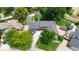 Charming home with mature trees, well-maintained lawn, and inviting front entrance at 7440 Quail St, Arvada, CO 80005