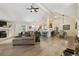 Spacious open-concept living room connected to the kitchen and dining area at 7440 Quail St, Arvada, CO 80005