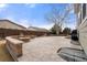 Entertain in this private stamped concrete patio with built-in fire pit and BBQ area at 4221 Pioneer Pl, Brighton, CO 80601