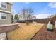 Expansive yard with lush lawn, privacy fence, and patio area for outdoor gatherings at 4221 Pioneer Pl, Brighton, CO 80601