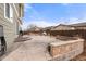 Spacious backyard with stamped concrete patio, grilling area, and low maintenance landscaping at 4221 Pioneer Pl, Brighton, CO 80601