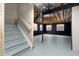 Unfinished basement features concrete floor, exposed beams, and multiple windows at 4221 Pioneer Pl, Brighton, CO 80601