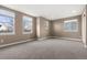 Bright, spacious bedroom with ample natural light from multiple windows and plush carpet at 4221 Pioneer Pl, Brighton, CO 80601