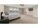 Large main bedroom with neutral paint, carpet, and lots of natural light at 4221 Pioneer Pl, Brighton, CO 80601