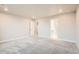 Spacious bedroom with carpet and two door entrances; great natural lighting at 9771 Rosalee Peak St, Littleton, CO 80125