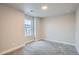 Cozy bedroom with carpeted floors, window with blinds, and natural light at 9771 Rosalee Peak St, Littleton, CO 80125