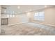 Large bonus room boasts neutral walls and carpet with large windows for natural light at 9771 Rosalee Peak St, Littleton, CO 80125