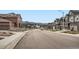 Street view of neighborhood showing colorful homes and mountain views in the distance at 9771 Rosalee Peak St, Littleton, CO 80125