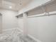 Walk-in closet with basic hanging racks and carpeted floors at 9771 Rosalee Peak St, Littleton, CO 80125