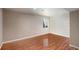 Bright bedroom with hardwood floors and a window, creating a versatile and inviting space at 2333 Paint Pony Cir, Castle Rock, CO 80108