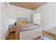 Cozy bedroom with light wood flooring, a comfortable bed, and a matching nightstand, perfect for relaxation at 2333 Paint Pony Cir, Castle Rock, CO 80108