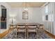 Elegant dining room featuring modern chandelier and large wooden table at 2333 Paint Pony Cir, Castle Rock, CO 80108