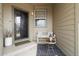 Cozy front porch featuring bench seating, decorative rug, and stylish decor at 2333 Paint Pony Cir, Castle Rock, CO 80108