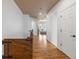 Inviting hallway with hardwood floors and neutral paint palette at 2333 Paint Pony Cir, Castle Rock, CO 80108