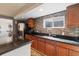 Stylish kitchenette featuring dark countertops, stainless steel appliances, and mosaic tile backsplash for a modern look at 2333 Paint Pony Cir, Castle Rock, CO 80108