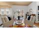 Sun-filled living room with comfortable seating, hardwood floors, and view to the backyard at 2333 Paint Pony Cir, Castle Rock, CO 80108