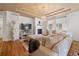 Bright living room featuring a fireplace, hardwood floors, and stylish furniture at 2333 Paint Pony Cir, Castle Rock, CO 80108