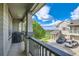 Inviting balcony view with a grill and outdoor seating overlooking the well manicured golf course and blue skies at 13151 Grant N Cir # C, Thornton, CO 80241