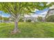 Community green space near the pool with lush grass and trees at 13151 Grant N Cir # C, Thornton, CO 80241