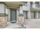 Charming front entry featuring stone accents, a modern door, and an ADT security system at 13151 Grant N Cir # C, Thornton, CO 80241