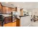 Well-equipped kitchen with stainless steel appliances, dark granite counters, and hardwood floors at 13151 Grant N Cir # C, Thornton, CO 80241