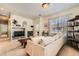 Comfortable living room with a fireplace, built-in shelving, and plenty of natural light at 13151 Grant N Cir # C, Thornton, CO 80241