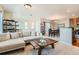 Spacious living area connecting the kitchen, dining space, and living room for easy entertaining at 13151 Grant N Cir # C, Thornton, CO 80241