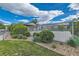 Fenced community pool area with manicured shrubs and walking trail at 13151 Grant N Cir # C, Thornton, CO 80241