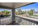 Balcony view of quiet residential street with mature trees and well-maintained landscaping at 1403 Valentia St, Denver, CO 80220
