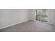 Bedroom with carpeted floors and sliding glass doors to a deck at 1403 Valentia St, Denver, CO 80220