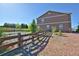 Landscaped backyard with a wooden fence, perfect for enjoying the outdoors at 735 Woodmoor Acres Dr, Monument, CO 80132