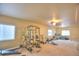 Spacious basement featuring a home gym and additional seating area for entertainment at 735 Woodmoor Acres Dr, Monument, CO 80132
