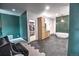 Spacious primary bathroom featuring a soaking tub, walk-in closet, and wood cabinets at 735 Woodmoor Acres Dr, Monument, CO 80132